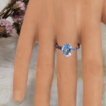 Sky Blue Topaz Ring With Blue Sapphire Gemstones..